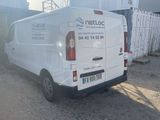 a white van that is parked on the side of the road