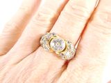 an image of a woman ' s hand with a diamond ring on it