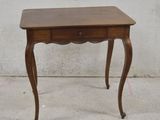 a small wooden table with a drawer on top of it