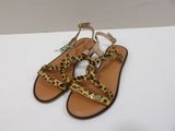 the leopard print sandals are on display on a white surface