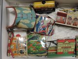 a box with a bunch of tin toys inside of it
