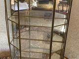 a close up of a glass display case on a marble floor