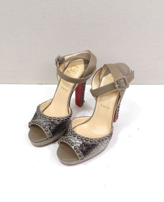 christian ' s shoes with a high heel and two straps on each side