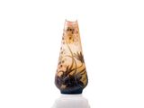a glass vase with a floral design on it