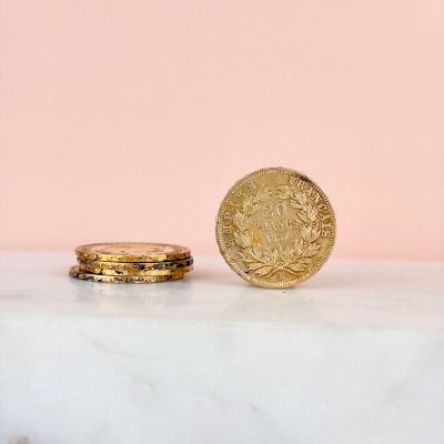 a close up of a coin sitting on top of a marble counter