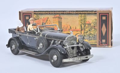 a toy car with a dog in the back of it