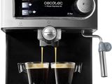 a close up of two cups of coffee being poured into a coffee machine