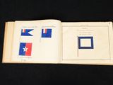 an open book with a picture of a flag on it