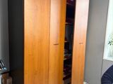 a man that is standing in front of a closet