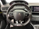 the interior of a car with a steering wheel and dashboard controls