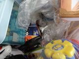 a pile of toys and other items in a plastic bag