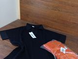 a black shirt and a bag of salmon on a table