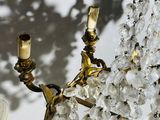 a chandelier that has a bunch of crystal beads hanging from it
