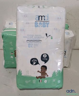 two packs of diapers sitting on top of each other on a table