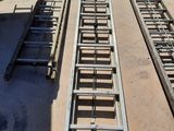 two ladders that are on the ground next to each other