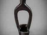 a black vase that is sitting on a table