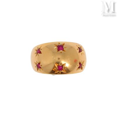 a close up of a gold ring with stars on it