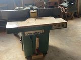 a picture of a table saw in a workshop