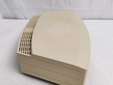 an image of a white computer sitting on top of a white table