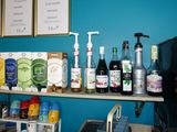 many bottles of alcohol on a shelf in a store