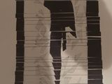 a picture of a shadow of a man holding a gun