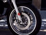 a close up of a motorcycle parked on the street