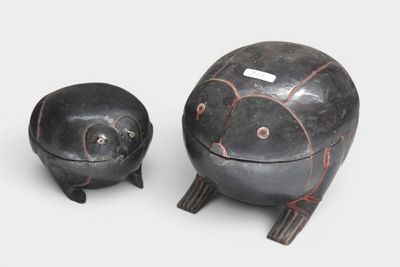 pair of black and red pottery figurines of a turtle and a turtle