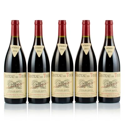 four bottles of red wine are lined up in a row