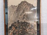 an image of a picture of a mountain with a village in it