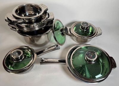 a lot of pots and pans sitting on a table