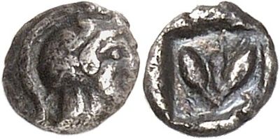 a silver coin with an image of a woman on it