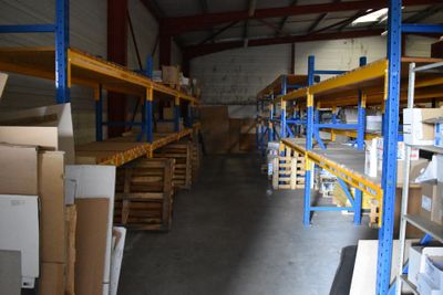 a large warehouse with shelves and boxes on it