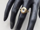 an image of a close up of a person ' s hand with a ring on it