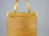 an image of a gold purse hanging from a hook