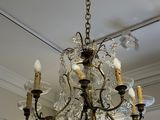a chandelier hanging from the ceiling in a living room