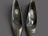 pair of women ' s shoes on a grey surface