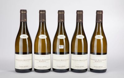 six bottles of wine are lined up in a row