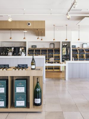 bottles of wine are on display in a wine shop