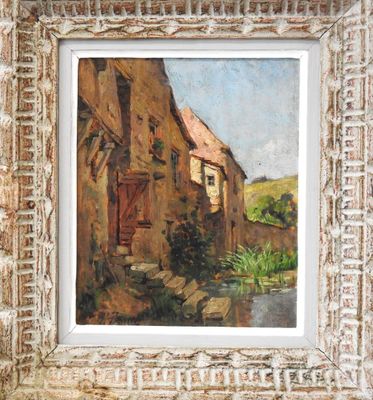 an oil painting of an old house in a frame on a brick wall