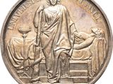 une image représentant une médaille d'argent sur laquelle figurent une femme et un chien