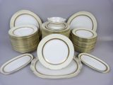 a lot of plates and bowls on the table