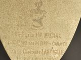 a close up of a metal object on a black surface