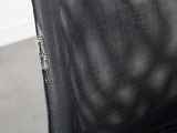 the back of a black office chair with a black seat and back cushion