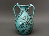 a blue vase with a black design on it