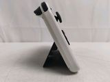 a close up of a cell phone holder on a table