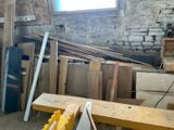 several pieces of wood are stacked on top of each other in a room