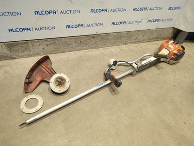 a picture of a pole saw and other tools sitting on the ground