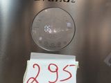 a sticker on the side of a stainless steel refrigerator