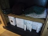 a shelf with a lot of items on top of it
