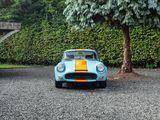 a blue and yellow car parked in a parking lot